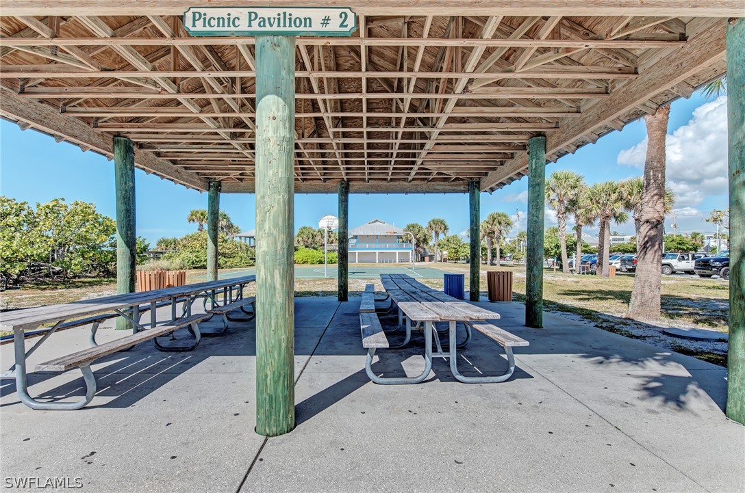 26074 Flower Road Punta Gorda, FL 33955 - Photo 14 of 26 a view of a porch with furniture and floor to ceiling window