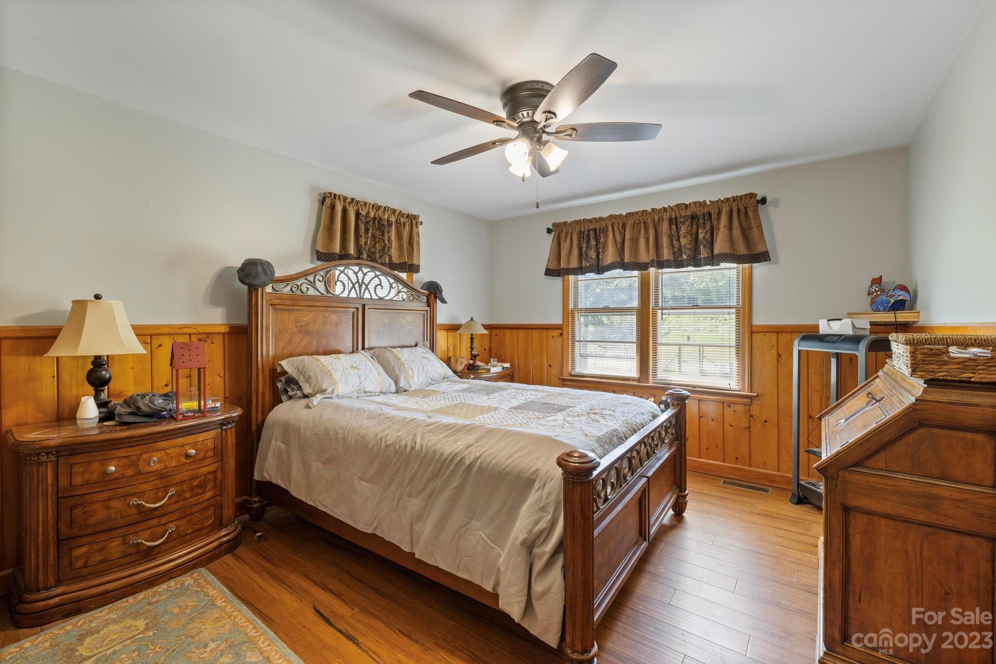 500 Indian Springs Road Clyde, NC 28721 - Photo 11 of 36 a bedroom with a bed and wooden floor