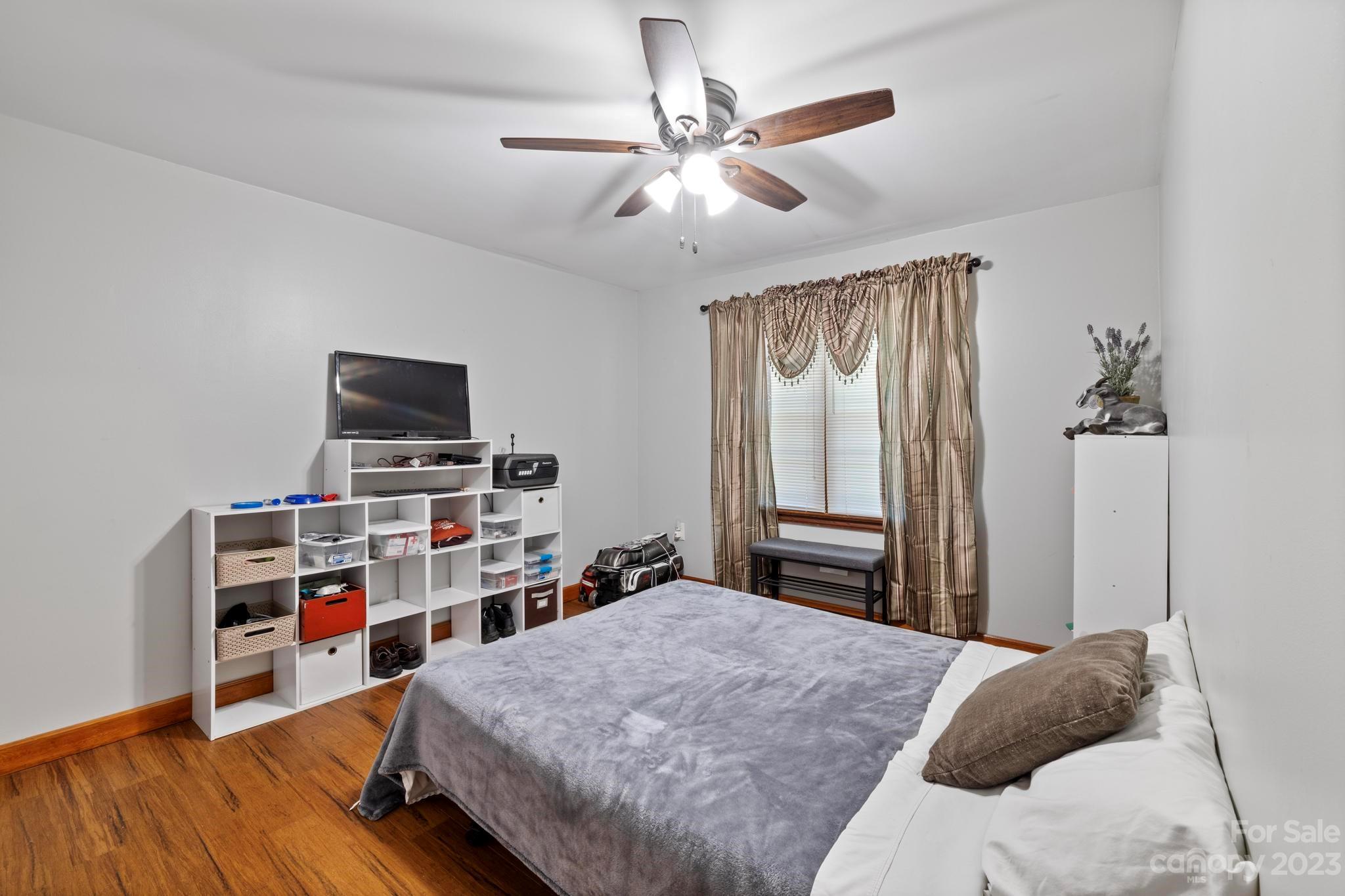 500 Indian Springs Road Clyde, NC 28721 - Photo 13 of 36 a bedroom with a bed and a flat screen tv