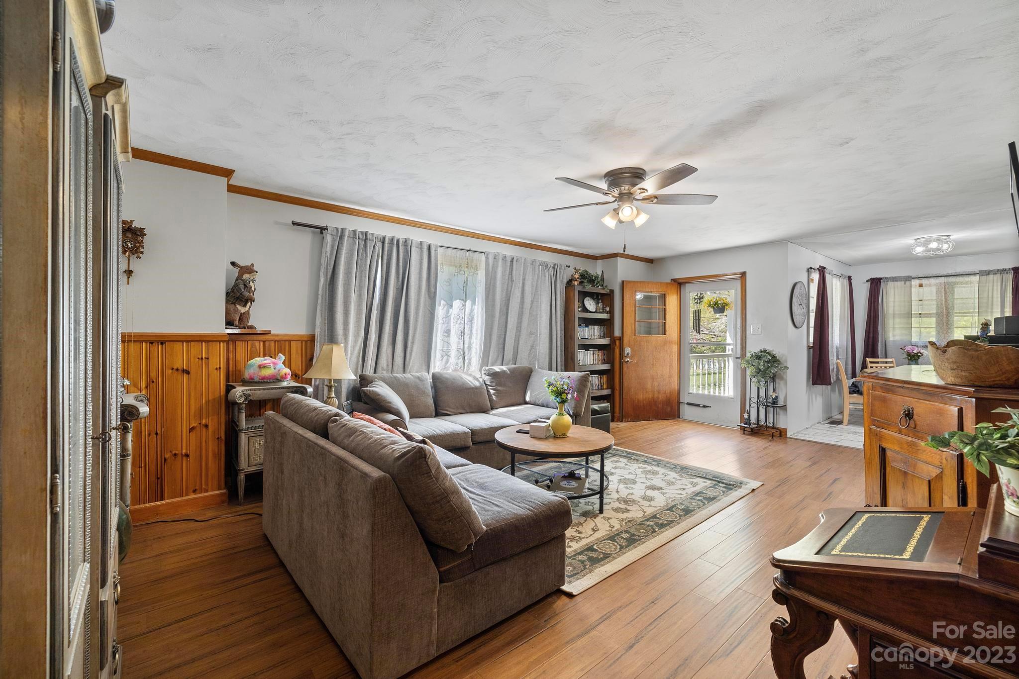 500 Indian Springs Road Clyde, NC 28721 - Photo 19 of 36 a living room with furniture and wooden floor