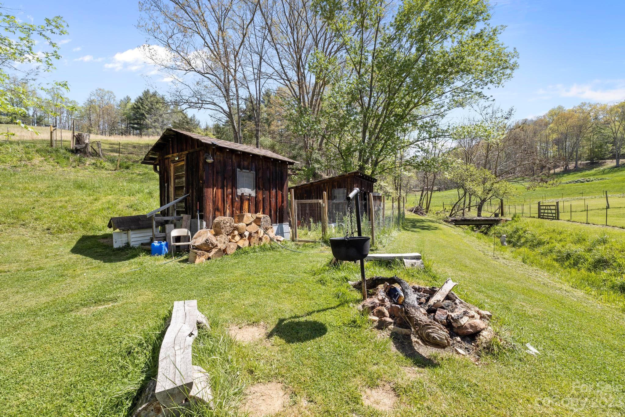 500 Indian Springs Road Clyde, NC 28721 - Photo 20 of 36 a view of a backyard with plants and patio