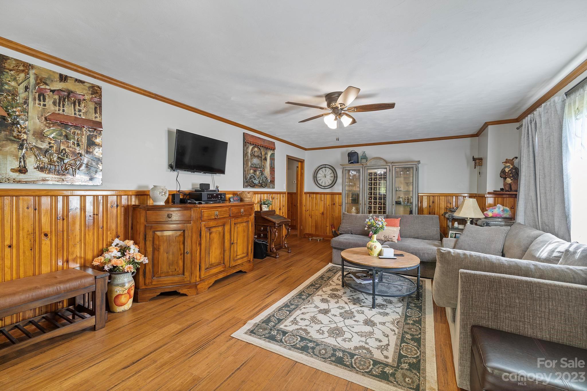 500 Indian Springs Road Clyde, NC 28721 - Photo 24 of 36 a living room with furniture and a flat screen tv