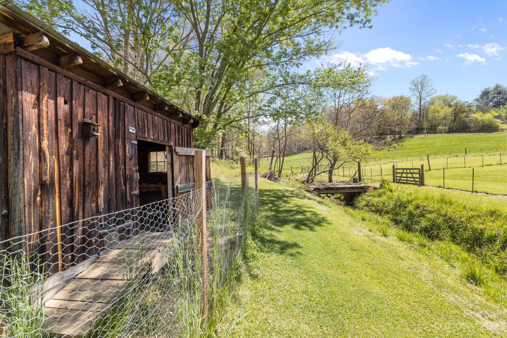 500 Indian Springs Road Clyde, NC 28721 - Photo 25 of 36 a view of yard with wooden fence