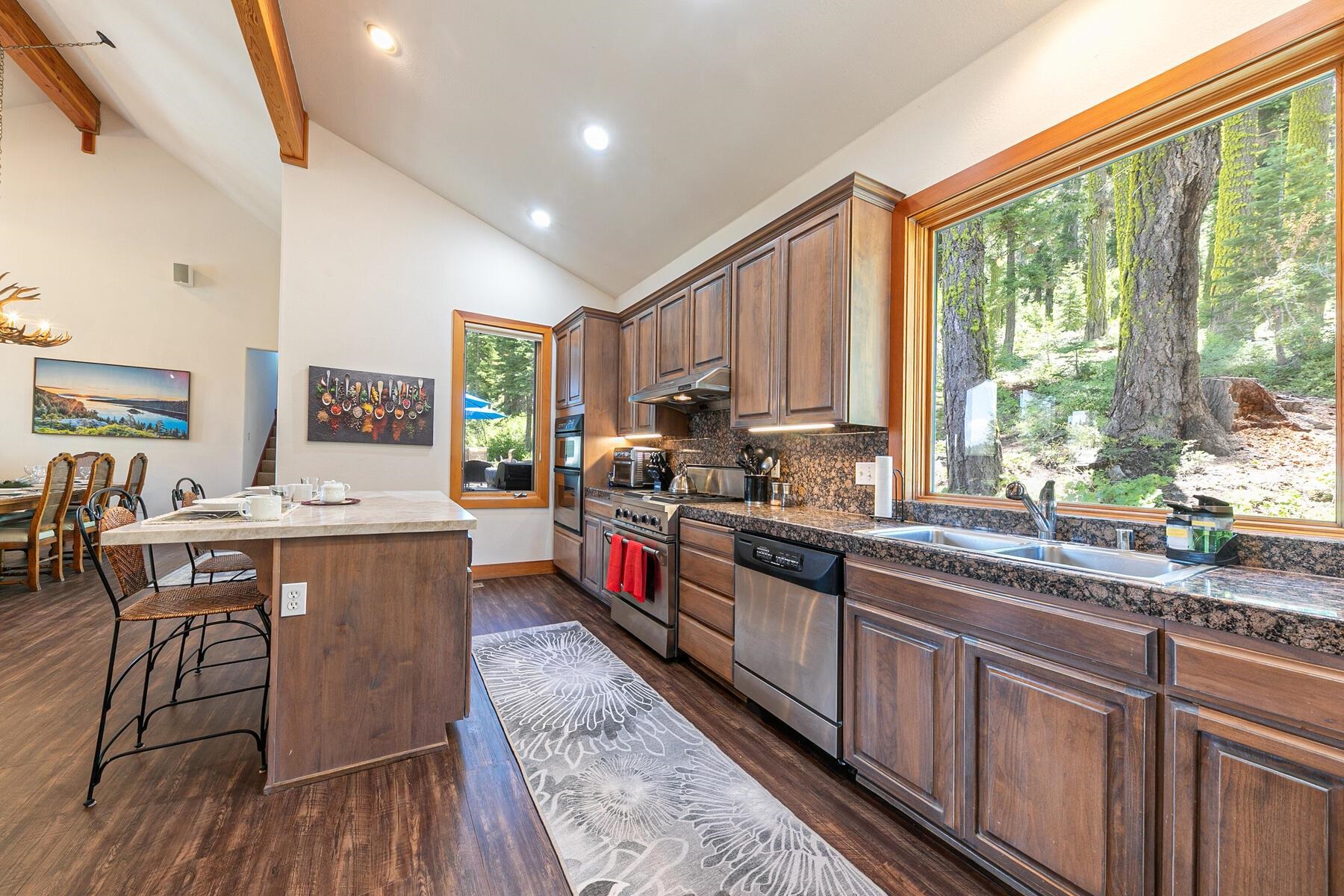 1141 Snow Crest Road Alpine Meadows, CA 96146 - Photo 10 of 27 a large kitchen with stainless steel appliances granite countertop lots of counter space and wooden floors