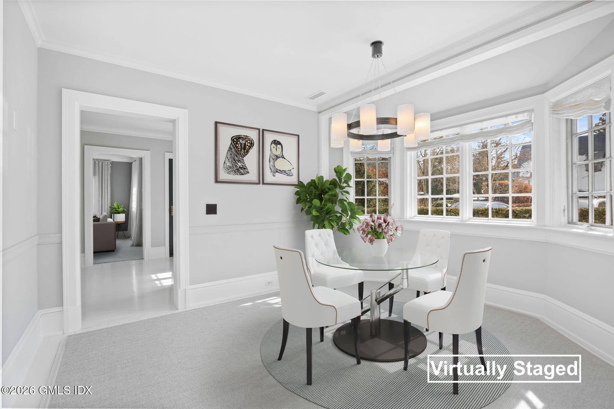 164 Round Hill Road Greenwich, CT 06831 - Photo 50 of 67 a dining room with furniture potted plants and wooden floor