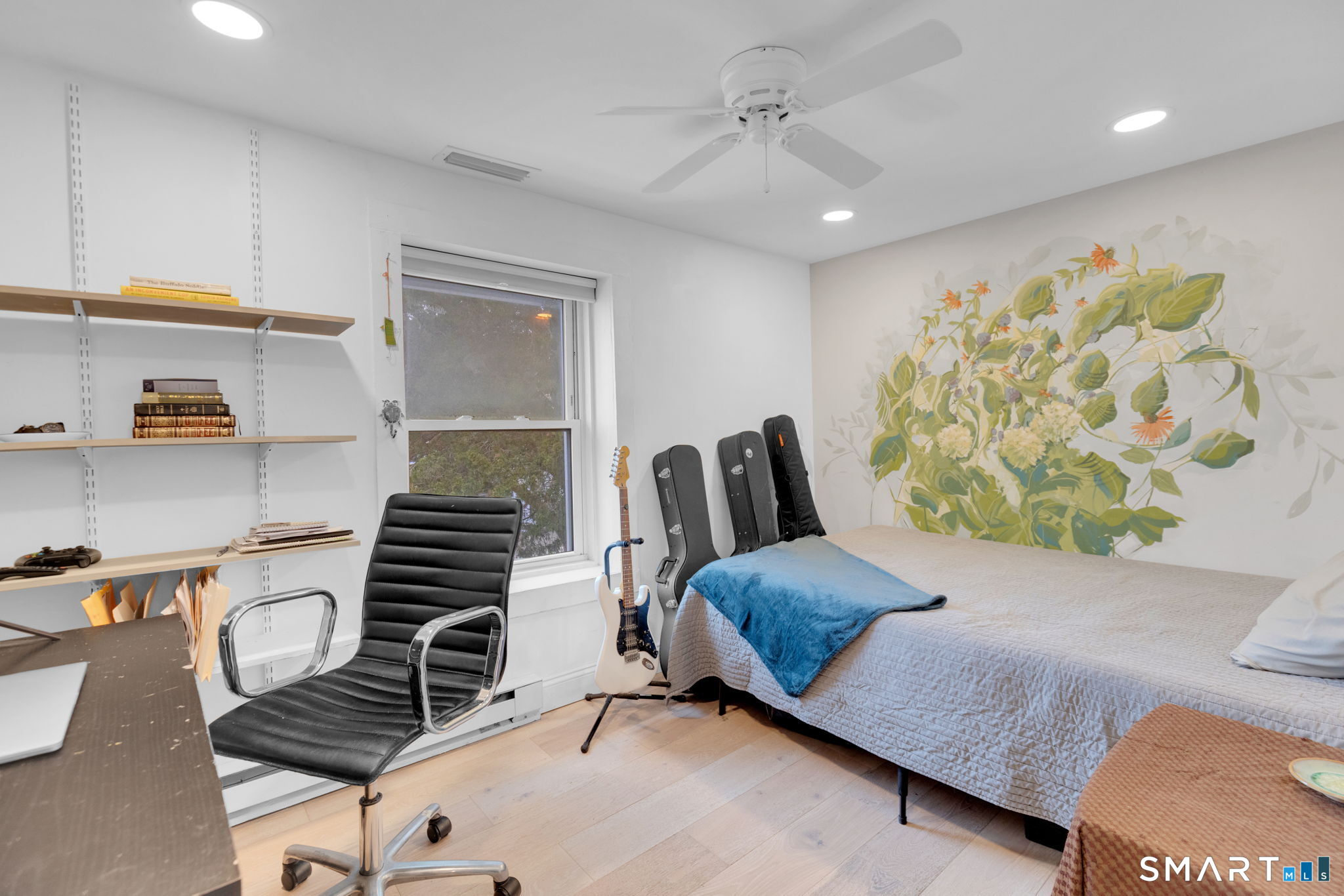 510 Reef Road Fairfield, CT 06824 - Photo 13 of 31 a bedroom with furniture and a wooden floor