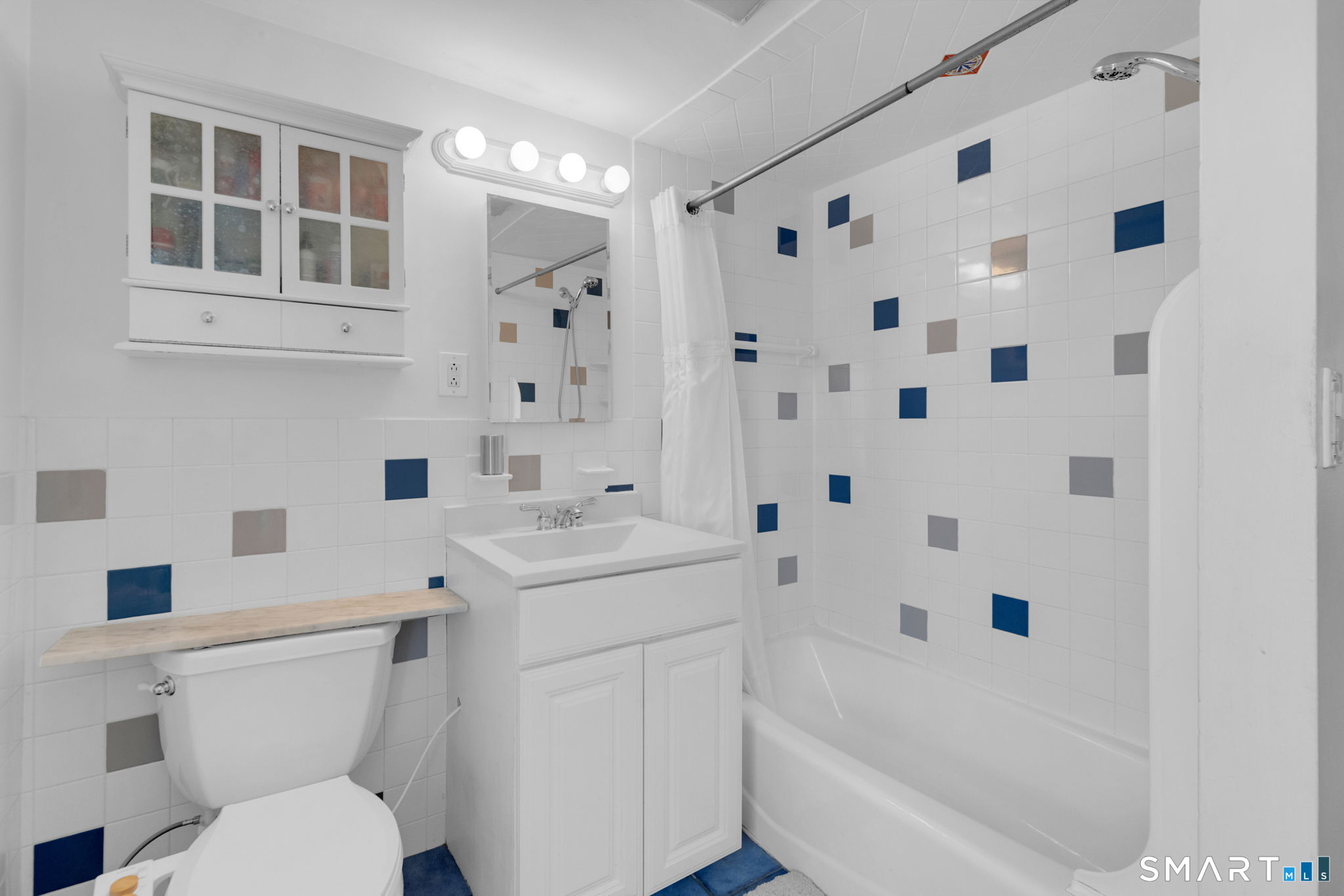 510 Reef Road Fairfield, CT 06824 - Photo 16 of 31 a bathroom with a sink toilet and shower