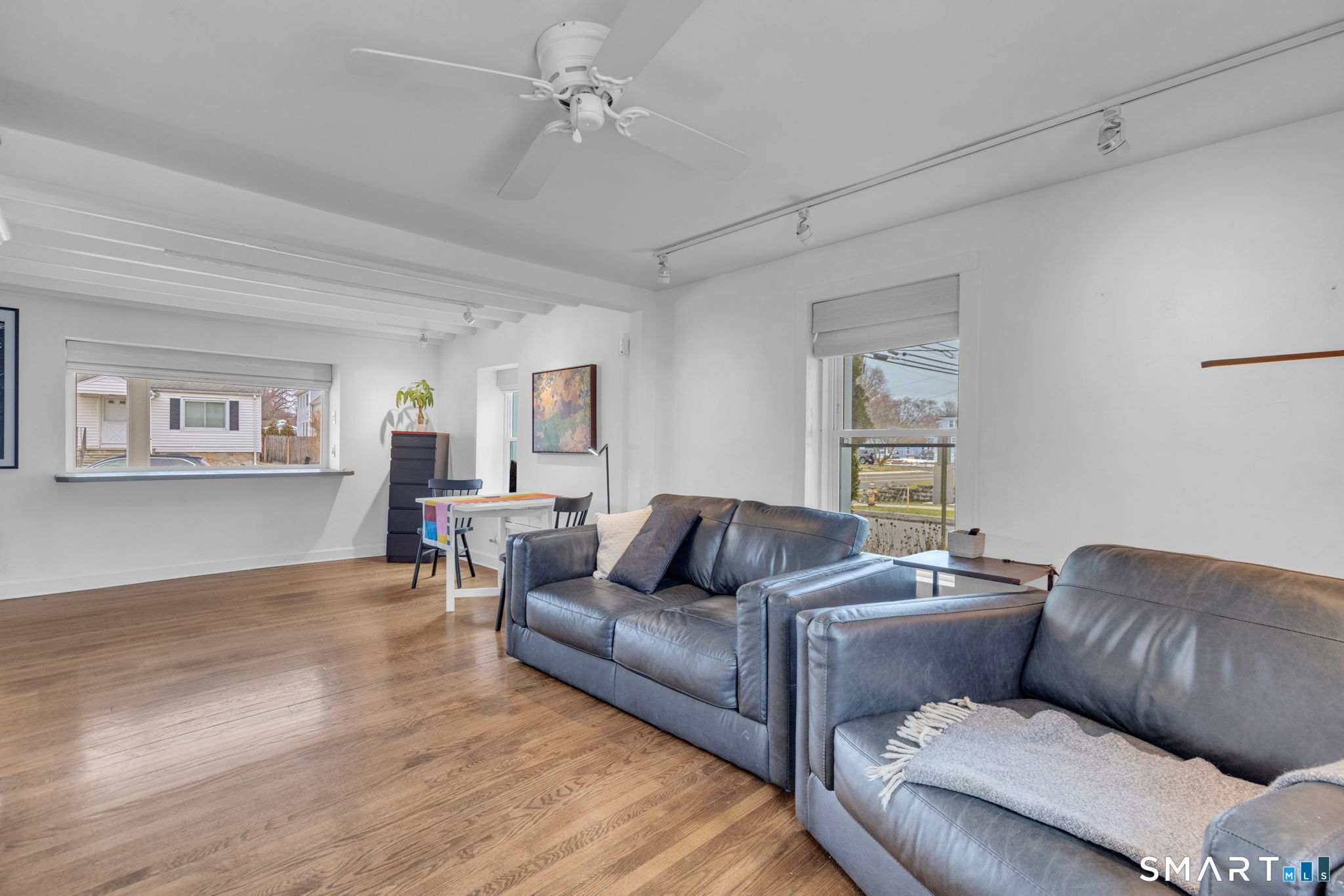 510 Reef Road Fairfield, CT 06824 - Photo 6 of 31 a living room with furniture and a wooden floor