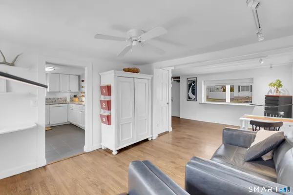 a living room with furniture and white walls