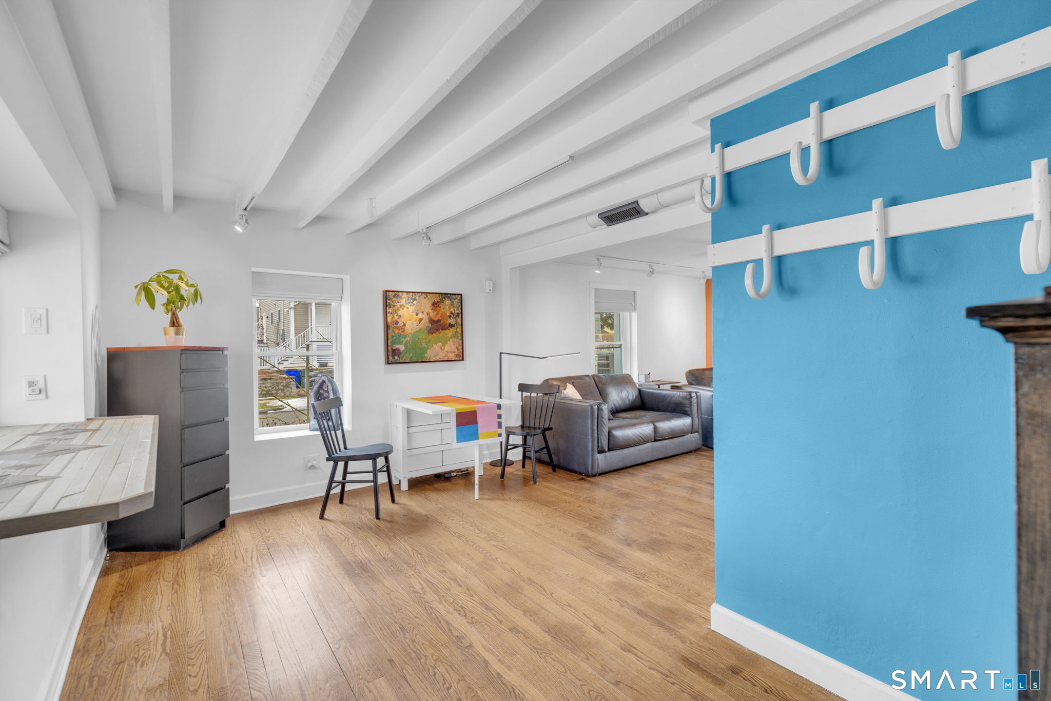 510 Reef Road Fairfield, CT 06824 - Photo 8 of 31 a living room with furniture and a wooden floor