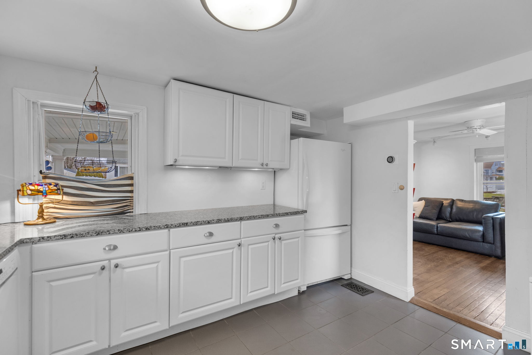 510 Reef Road Fairfield, CT 06824 - Photo 10 of 31 a kitchen with stainless steel appliances granite countertop a sink a stove and a refrigerator