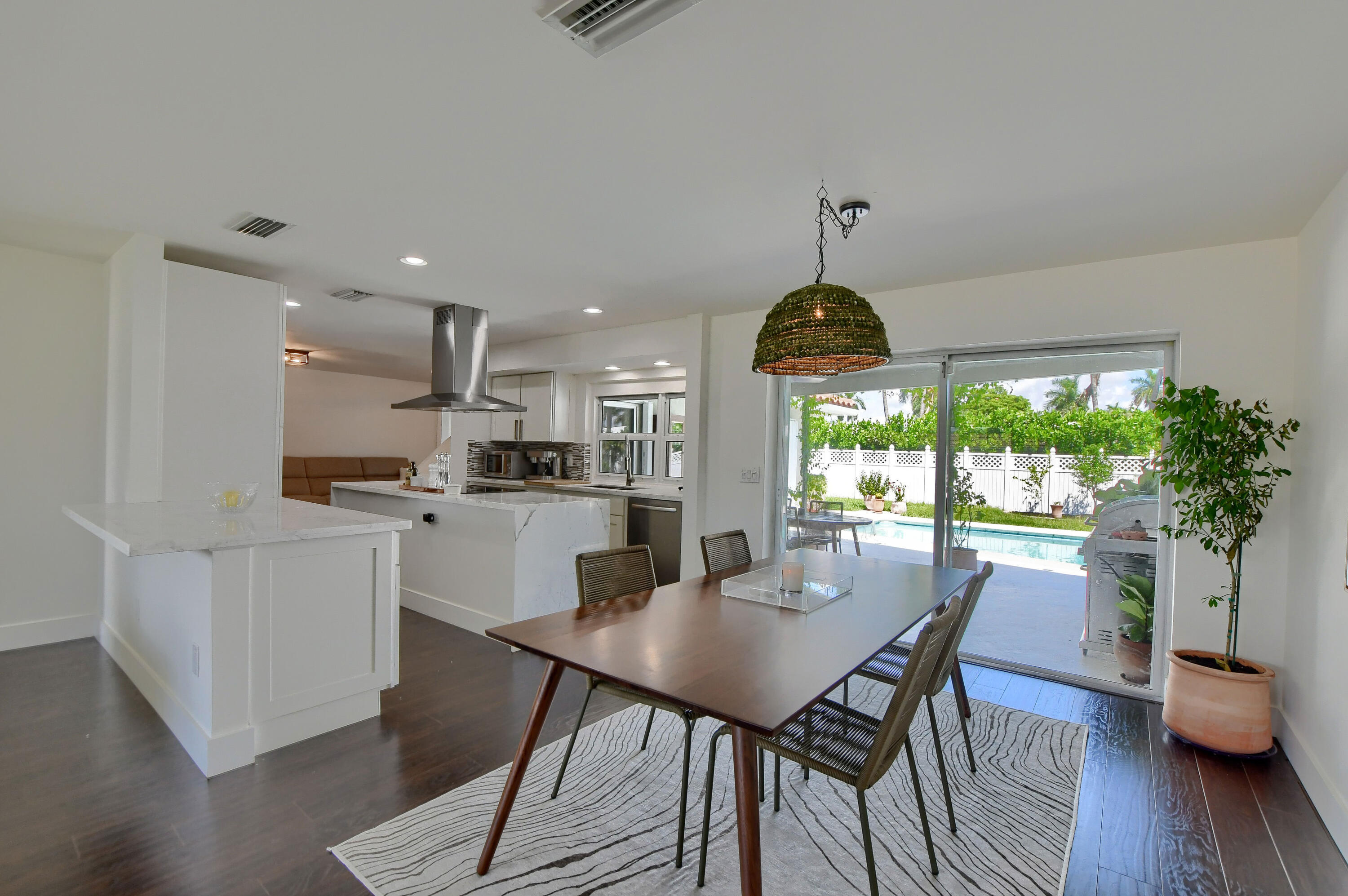 1167 Southwest 13th Drive Boca Raton, FL 33486 - Photo 11 of 41 a dining room with furniture window and wooden floor