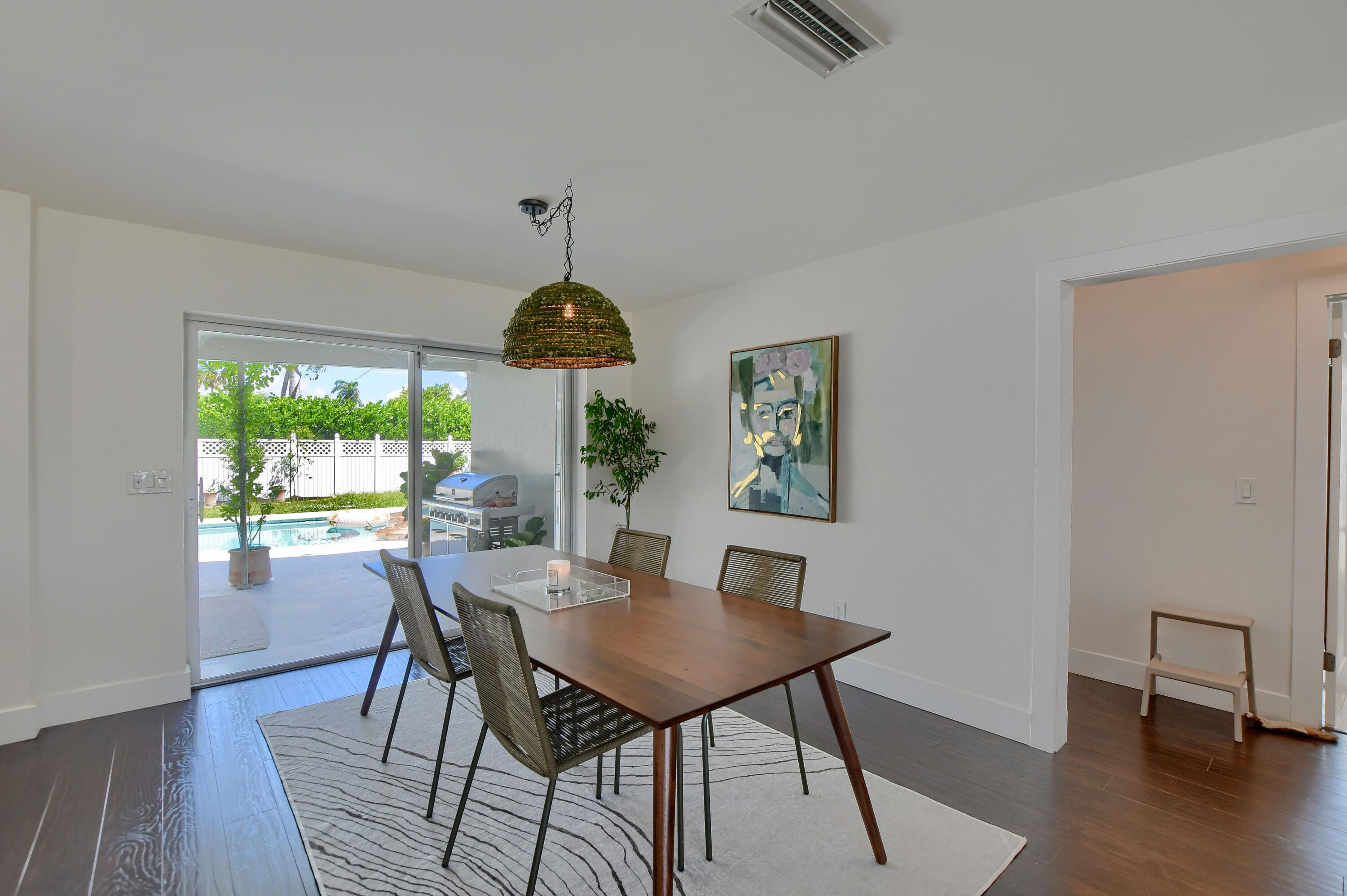 1167 Southwest 13th Drive Boca Raton, FL 33486 - Photo 12 of 41 a view of a dining room with furniture window and wooden floor