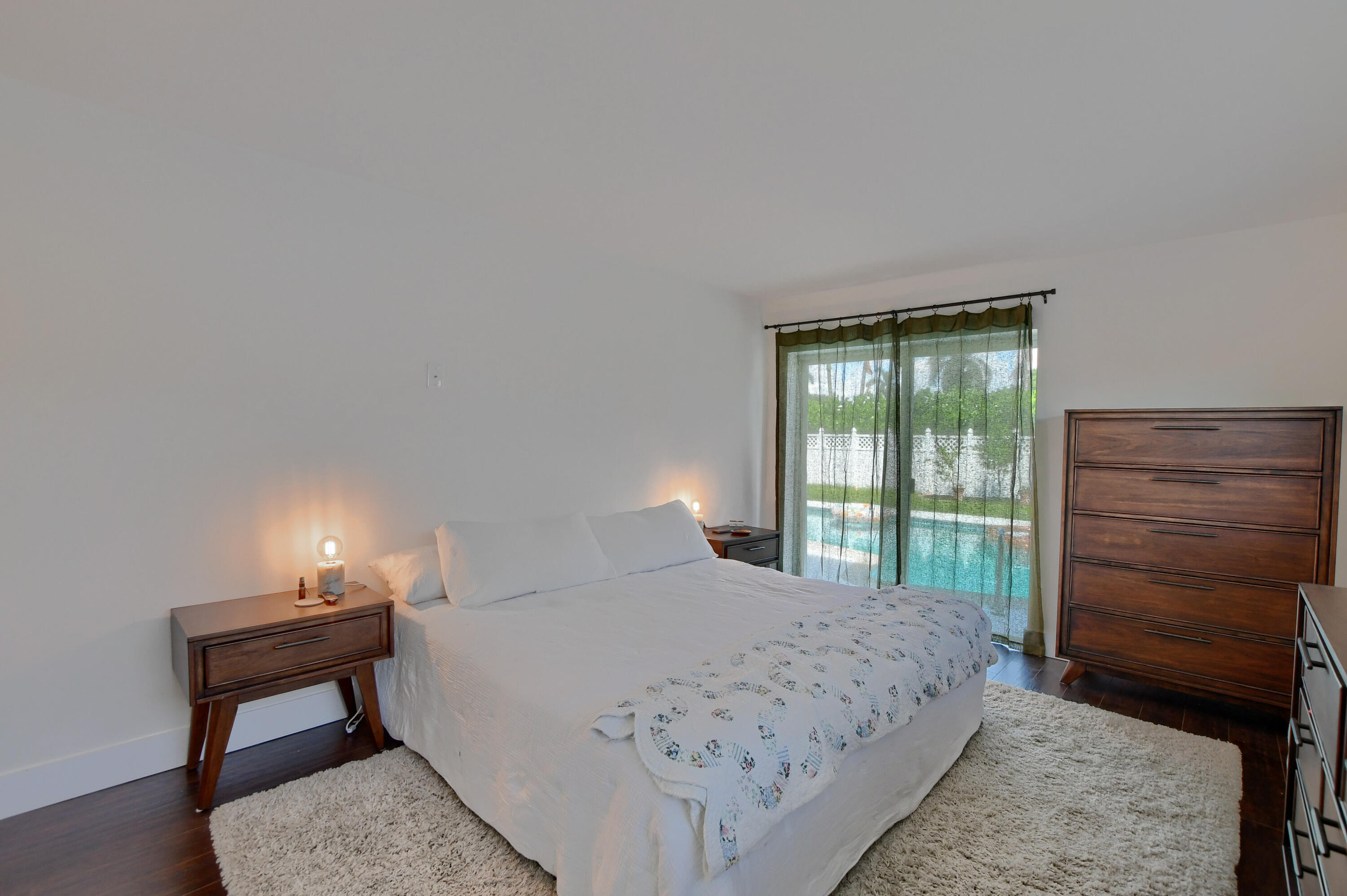 1167 Southwest 13th Drive Boca Raton, FL 33486 - Photo 17 of 41 a bedroom with a bed and a dresser