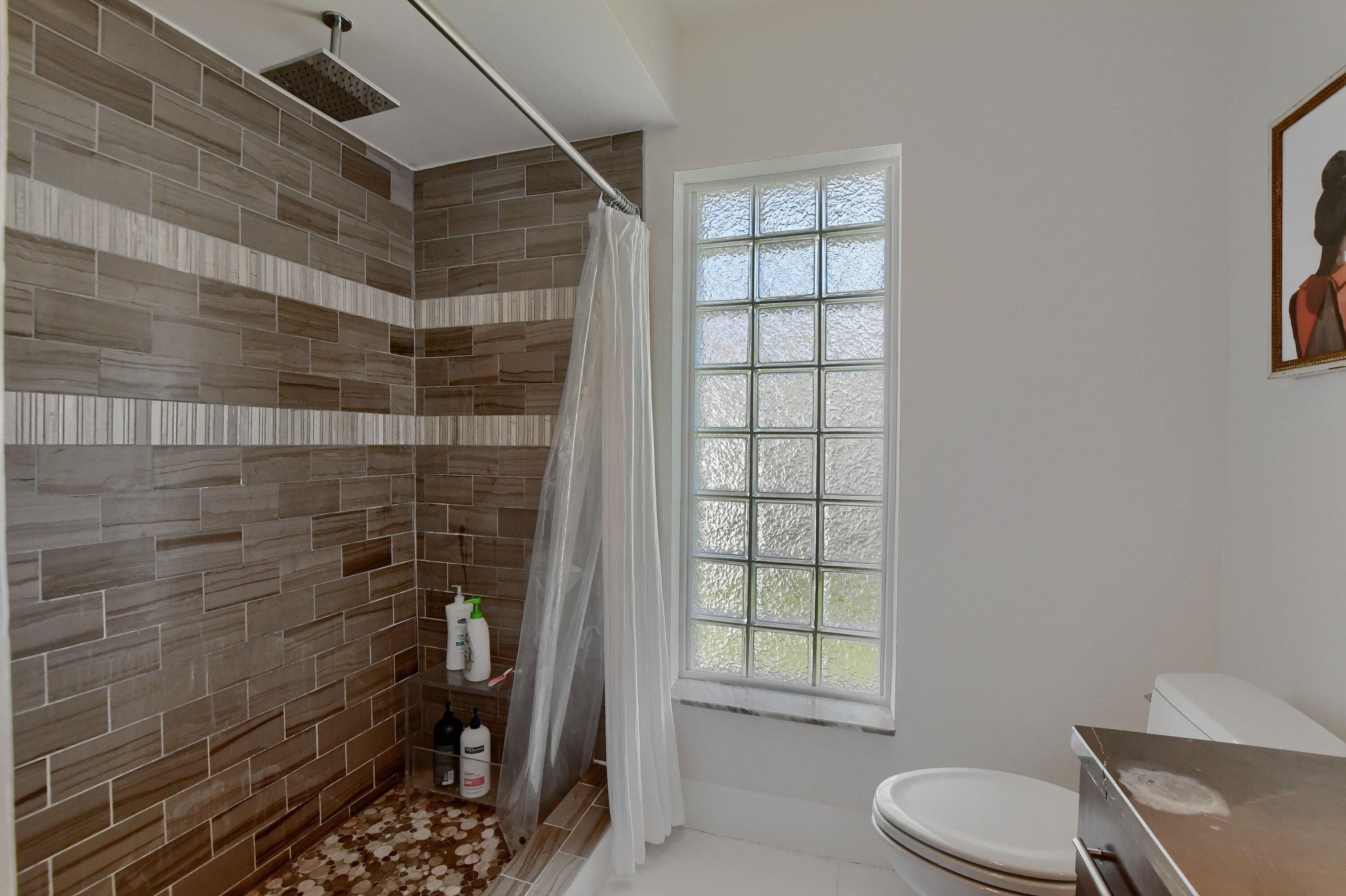 1167 Southwest 13th Drive Boca Raton, FL 33486 - Photo 21 of 41 a bathroom with a toilet and a shower
