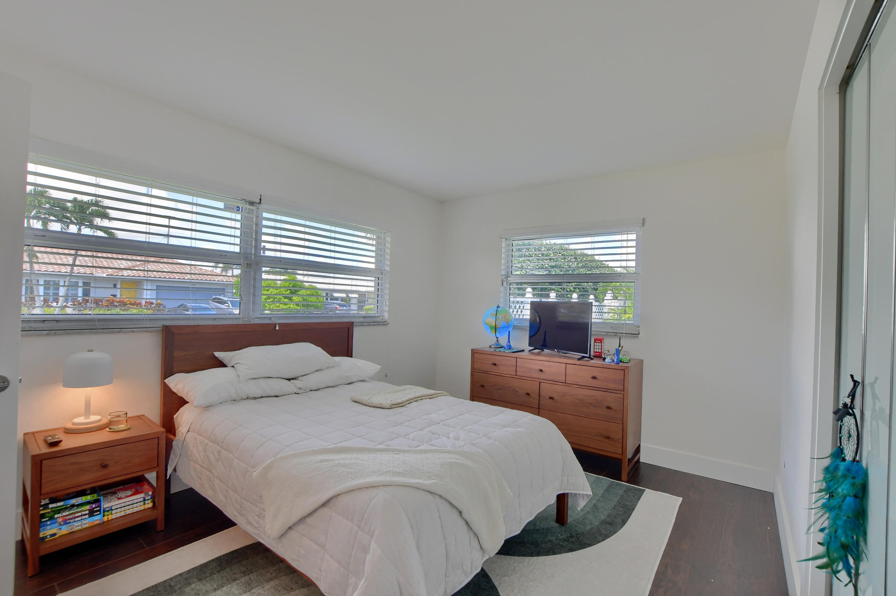 1167 Southwest 13th Drive Boca Raton, FL 33486 - Photo 24 of 41 a bedroom with a bed and window