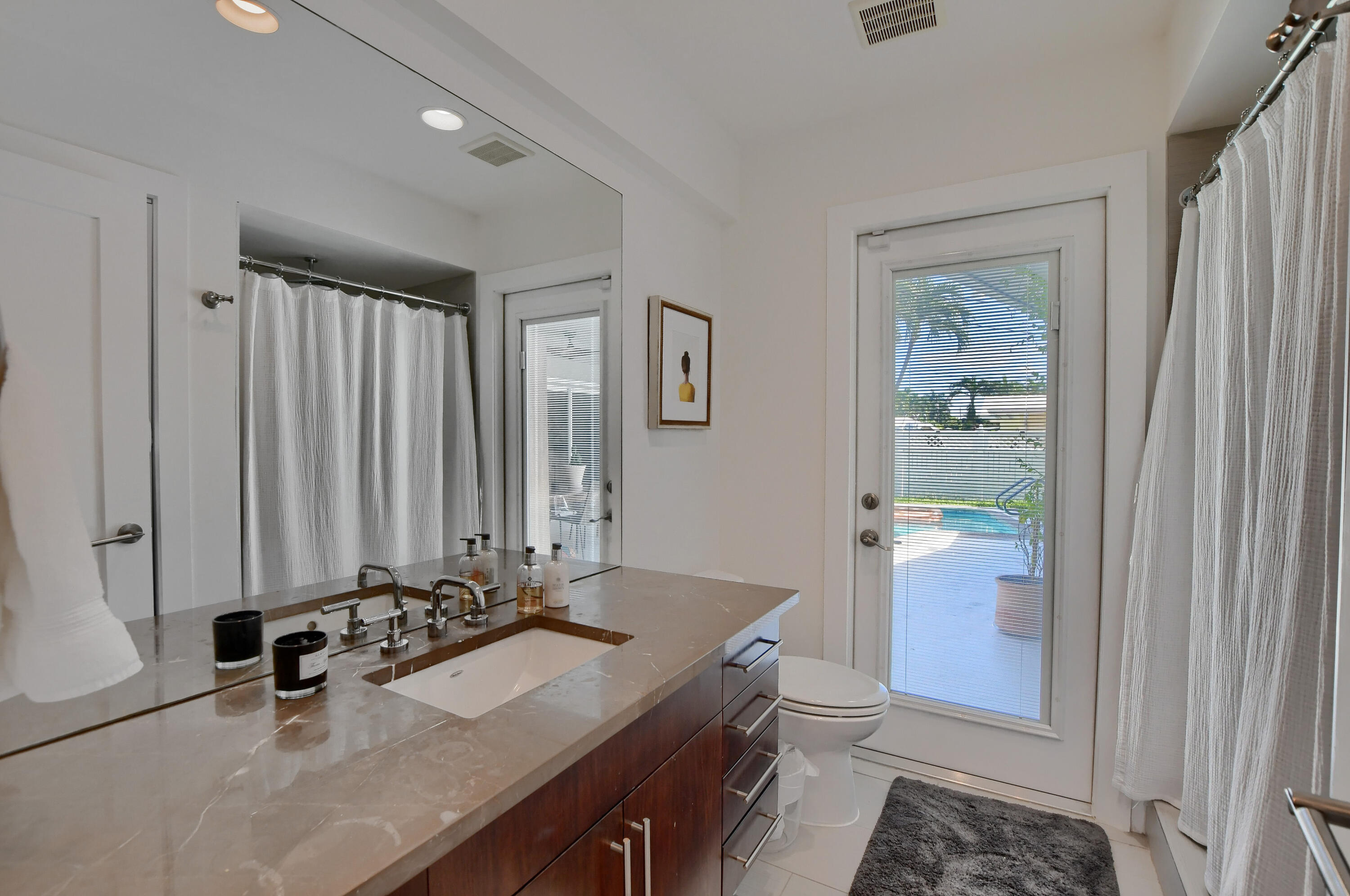 1167 Southwest 13th Drive Boca Raton, FL 33486 - Photo 28 of 41 a room with a sink and a mirror