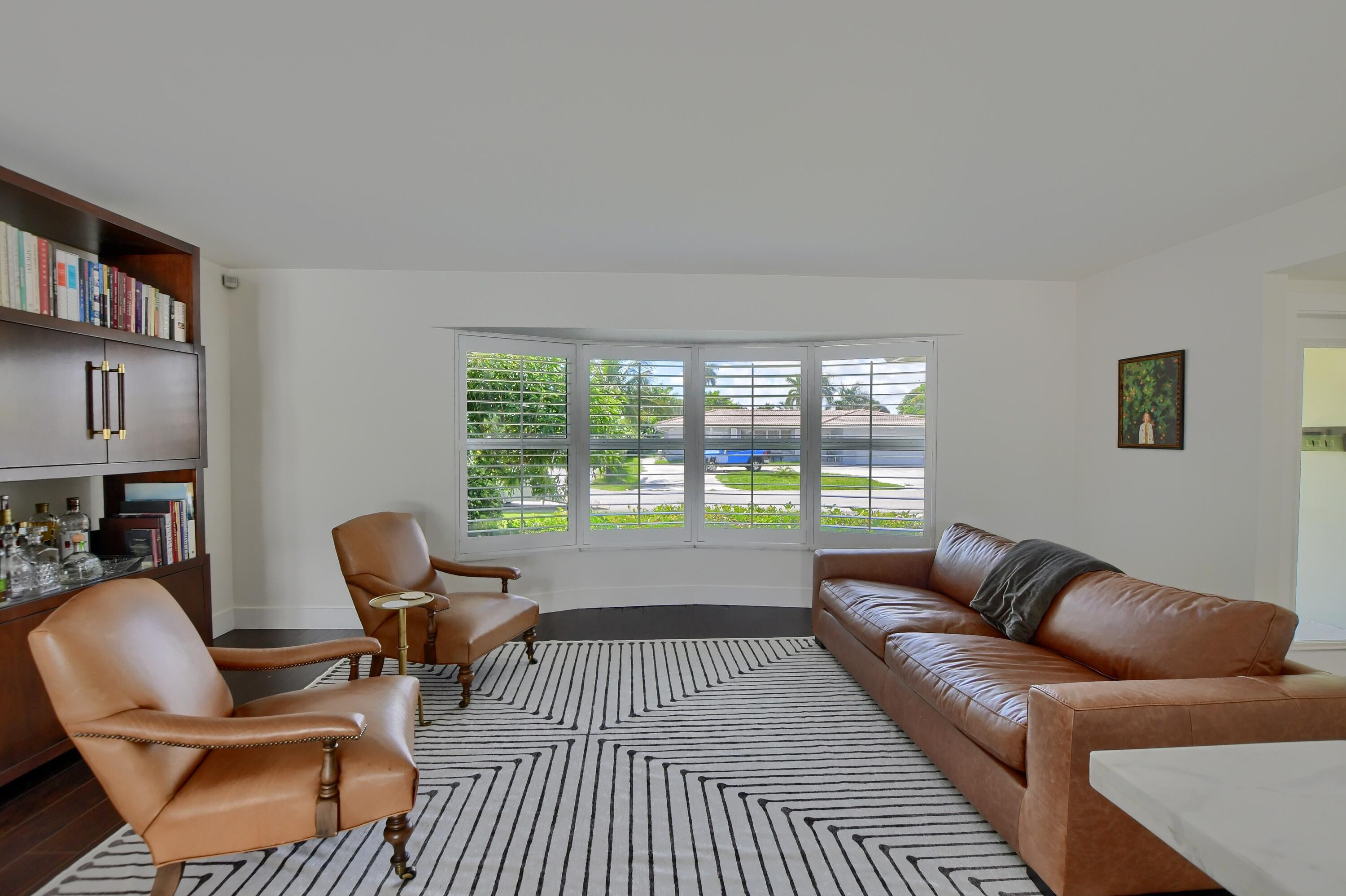 1167 Southwest 13th Drive Boca Raton, FL 33486 - Photo 3 of 41 a living room with furniture and a floor to ceiling window