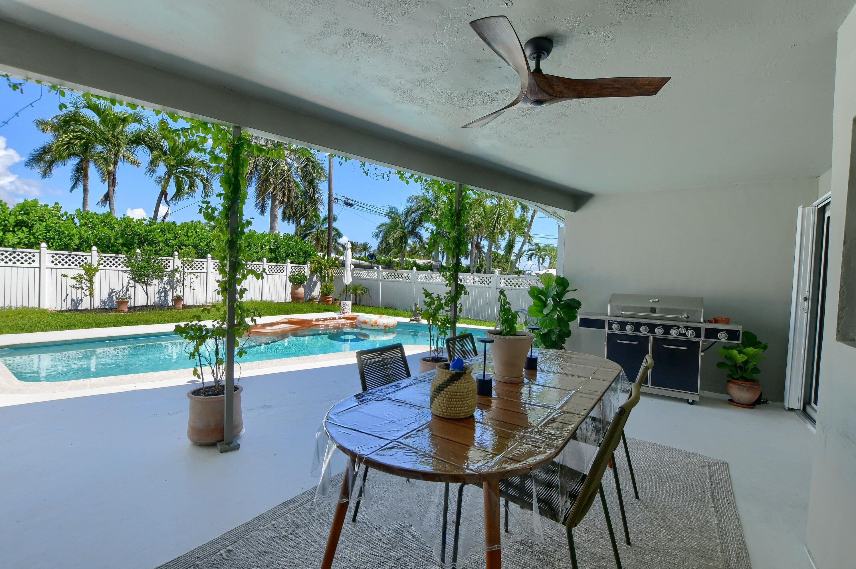 1167 Southwest 13th Drive Boca Raton, FL 33486 - Photo 33 of 41 a view of a dining room with furniture window and outside view