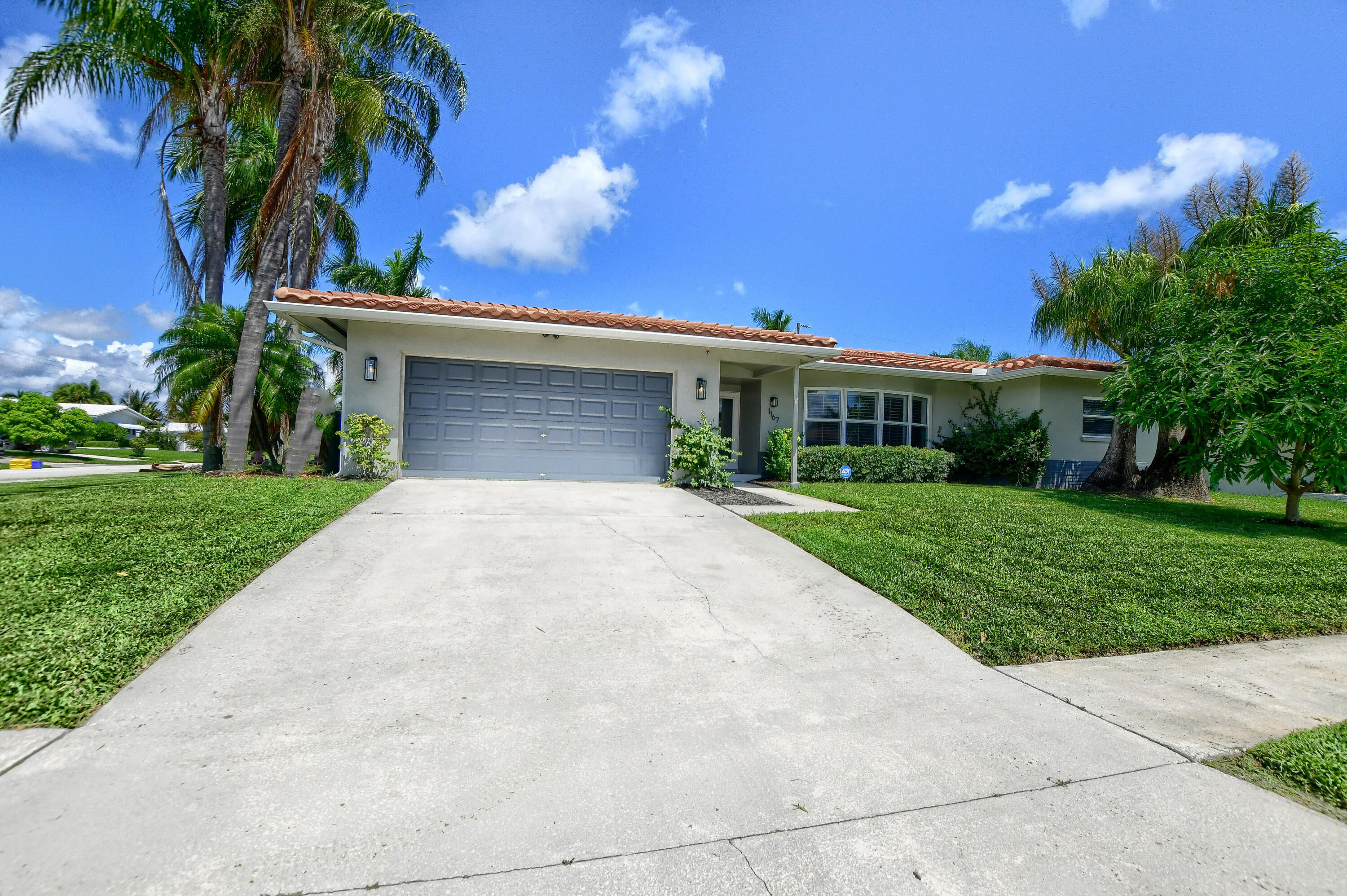 1167 Southwest 13th Drive Boca Raton, FL 33486 - Photo 40 of 41 a view of house with yard and green space