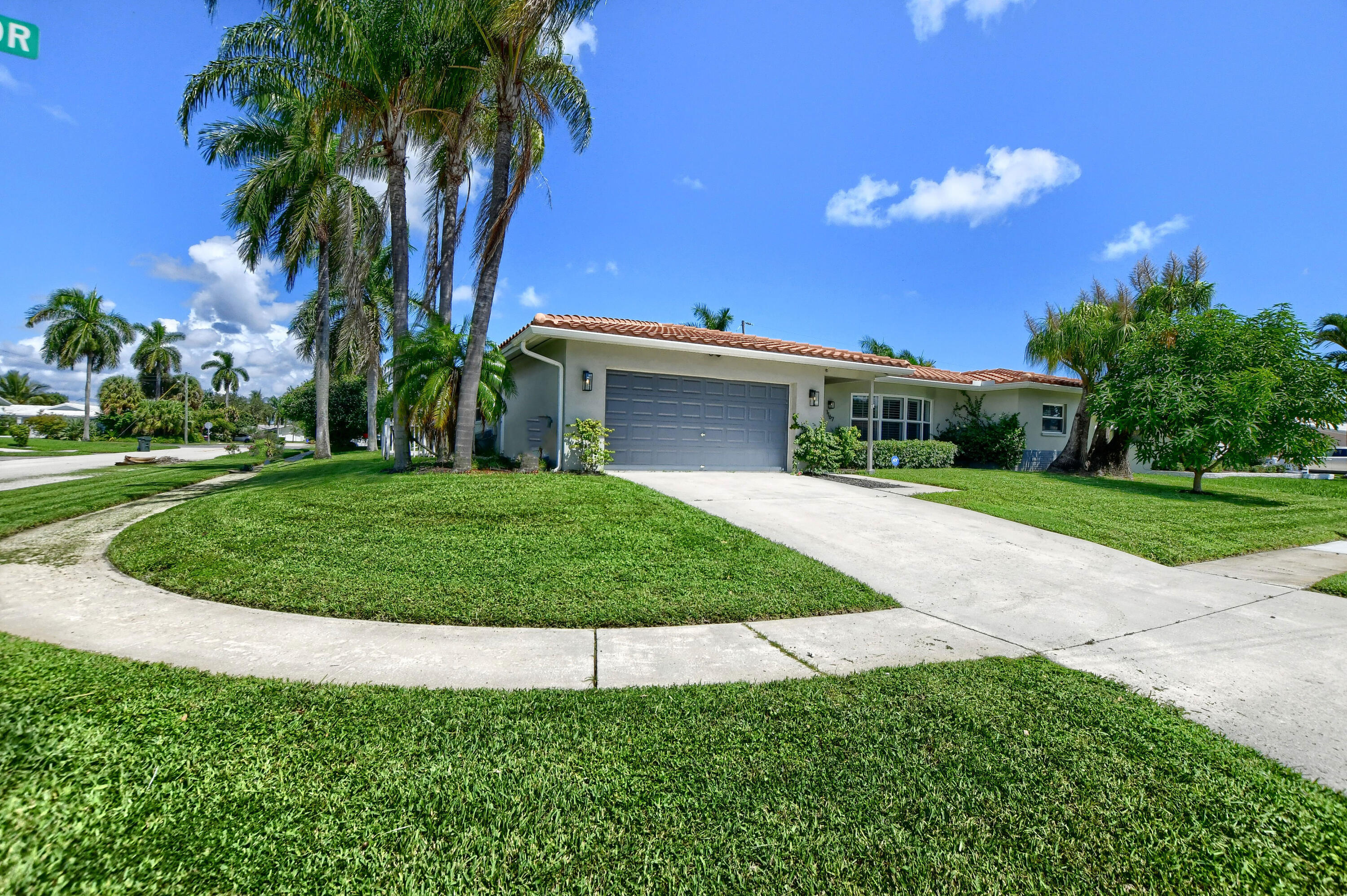 1167 Southwest 13th Drive Boca Raton, FL 33486 - Photo 41 of 41 a view of a house with a swimming pool and a yard