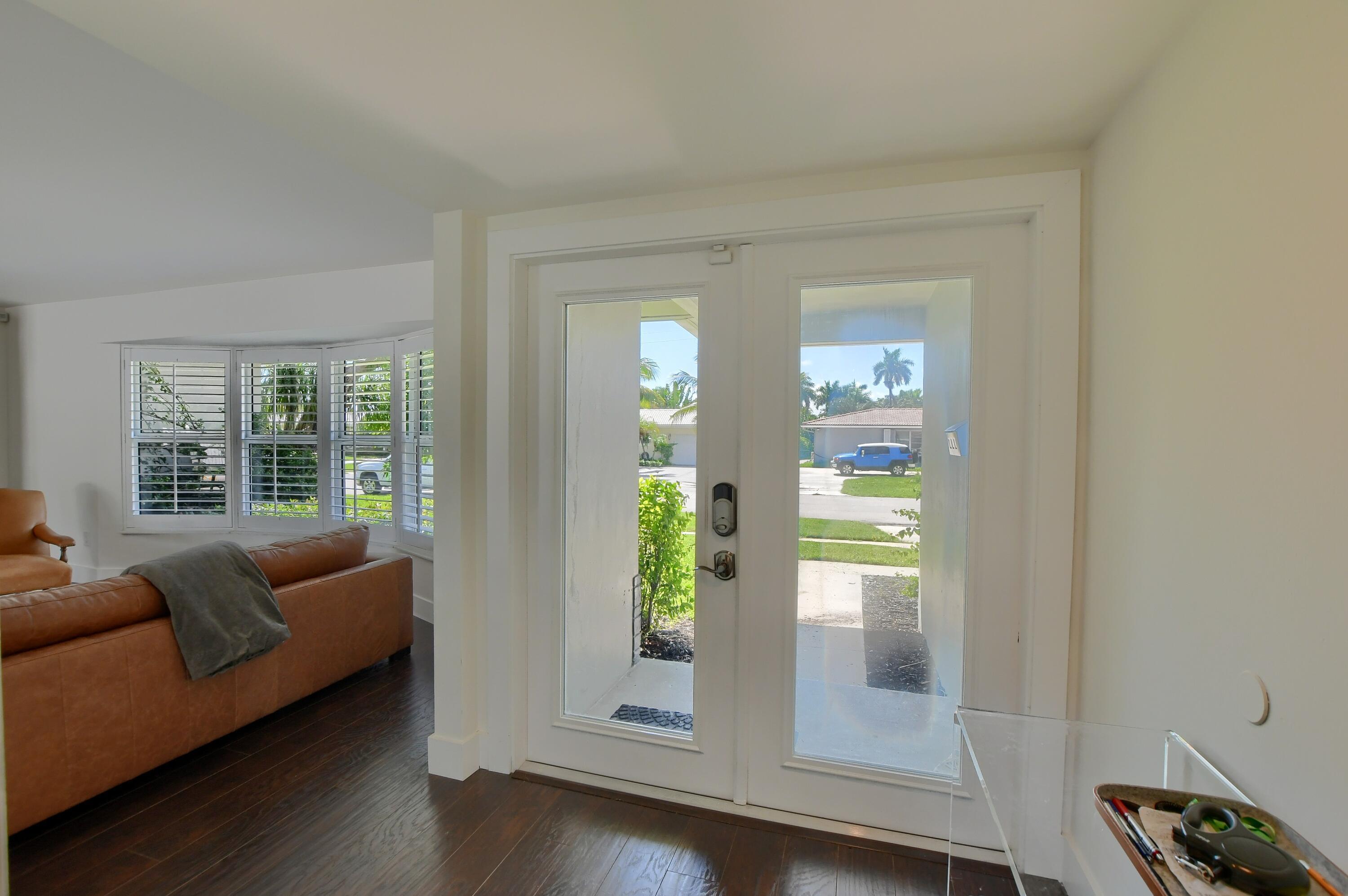1167 Southwest 13th Drive Boca Raton, FL 33486 - Photo 6 of 41 a living room with furniture and a window