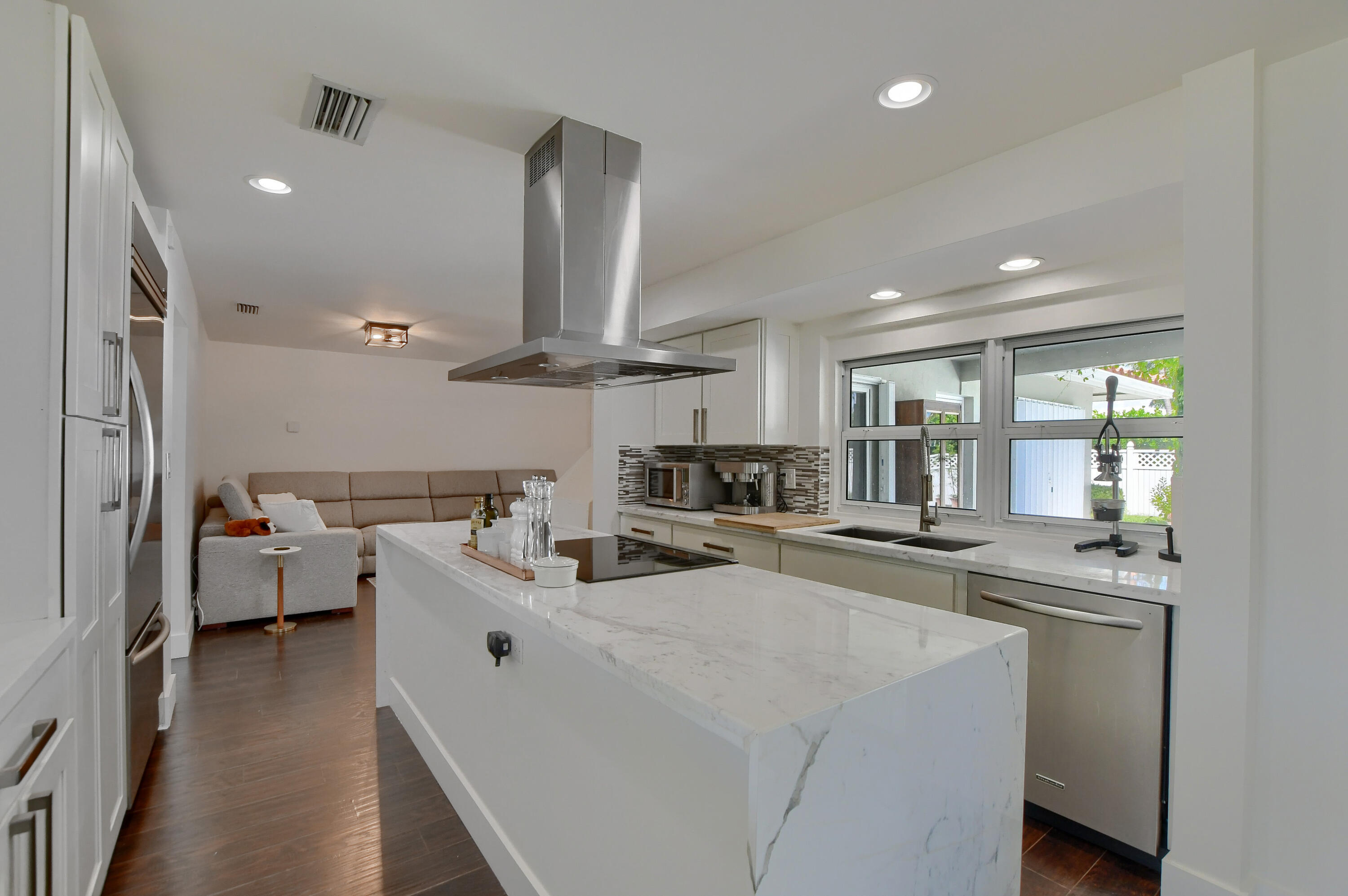 1167 Southwest 13th Drive Boca Raton, FL 33486 - Photo 8 of 41 a kitchen with sink stove and cabinets