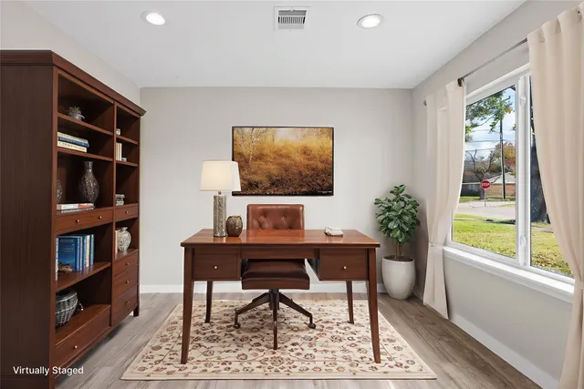 a workspace with furniture and a bookshelf