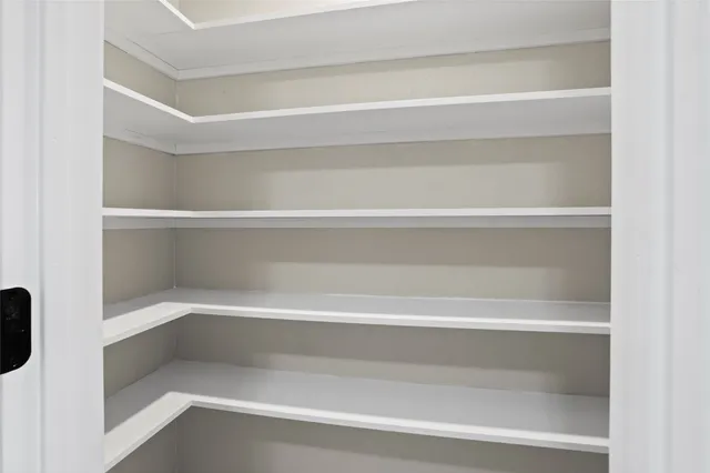 a view of a yard with fountain in front of it