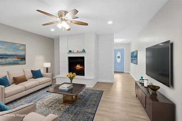 a living room with furniture and a flat screen tv