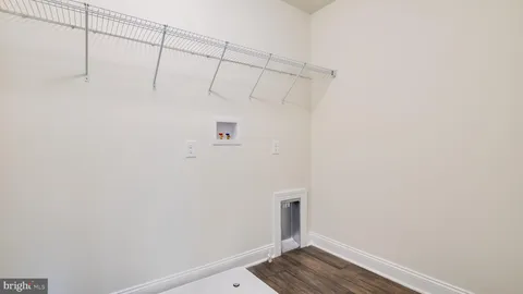 a bathroom with a toilet a sink a tub and mirror