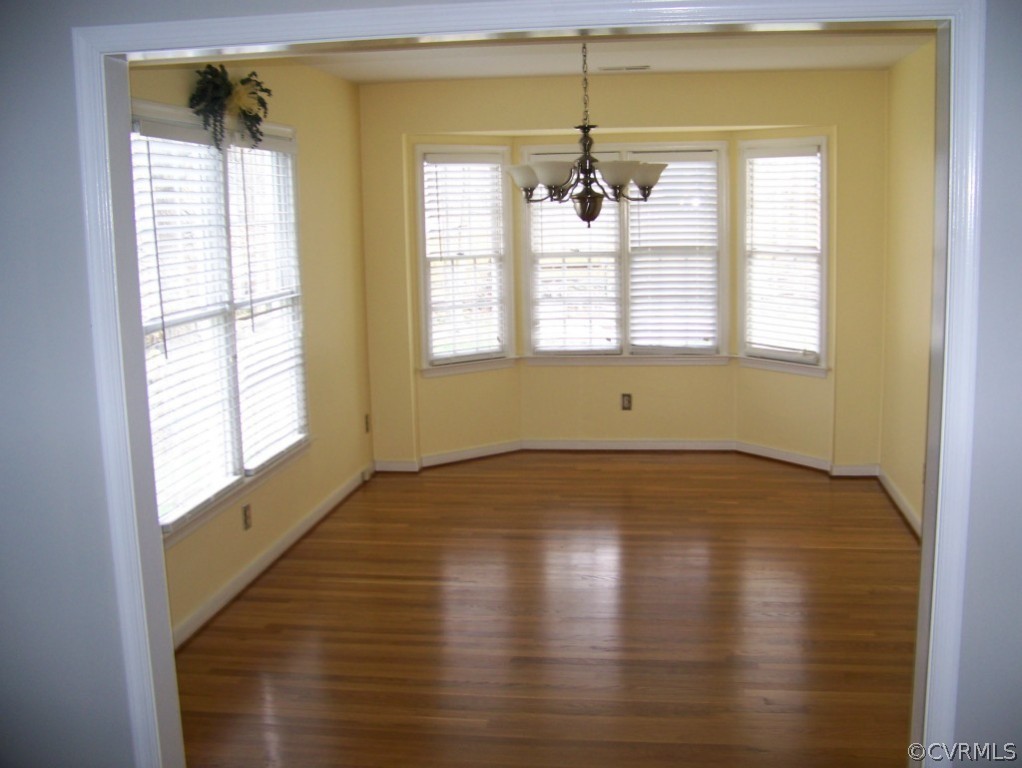 2517 Retrievers Ridge Road Richmond, VA 23233 - Photo 3 of 19 a view of an empty room with a window and wooden floor