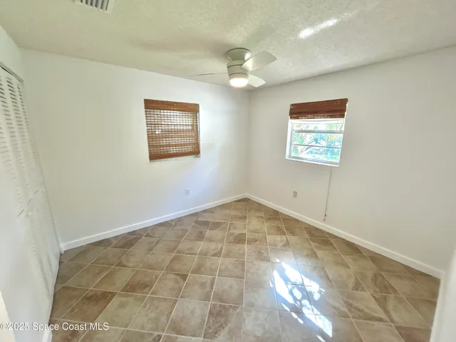 a view of a hallway with wooden floors