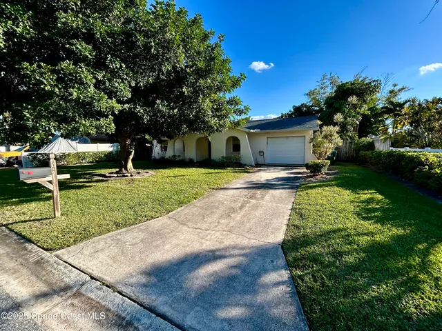 a view of a backyard with a garden
