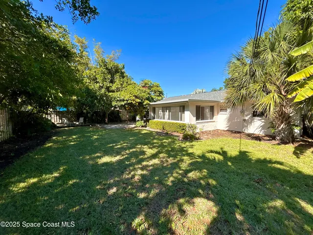 a view of a house with a big yard