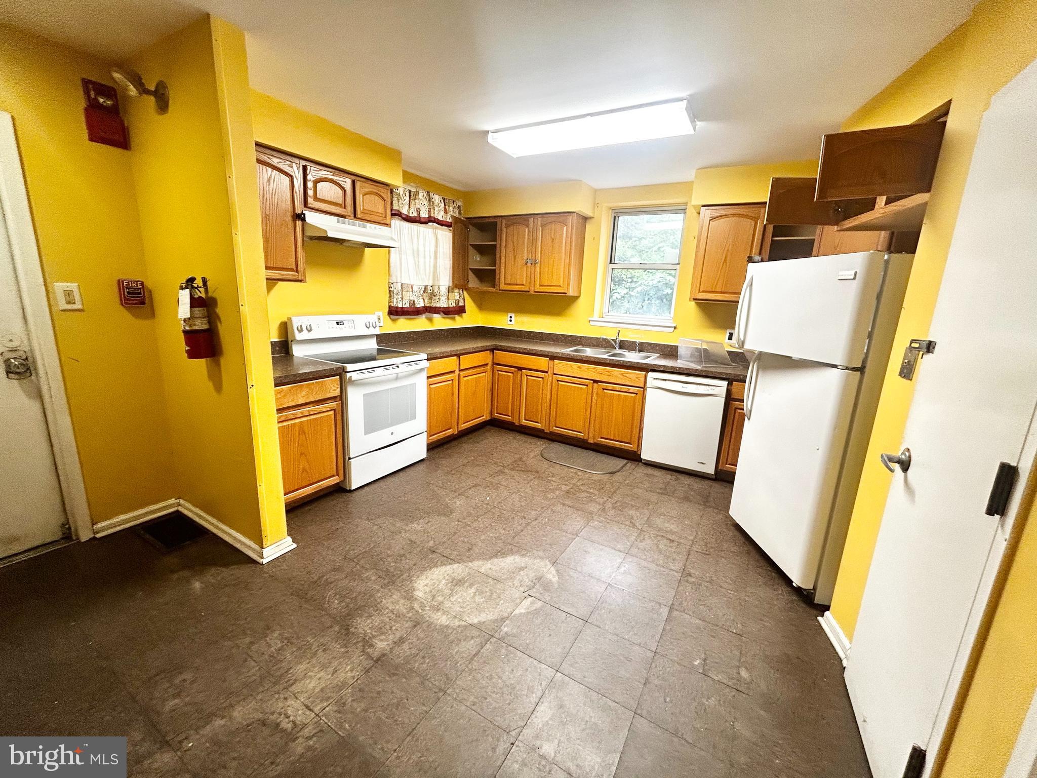 3824 Lancaster Avenue Philadelphia, PA 19104 - Photo 11 of 20 a kitchen with a refrigerator and a stove