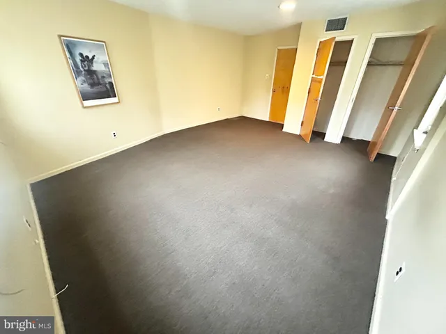 a view of a room with wooden floor and stairs