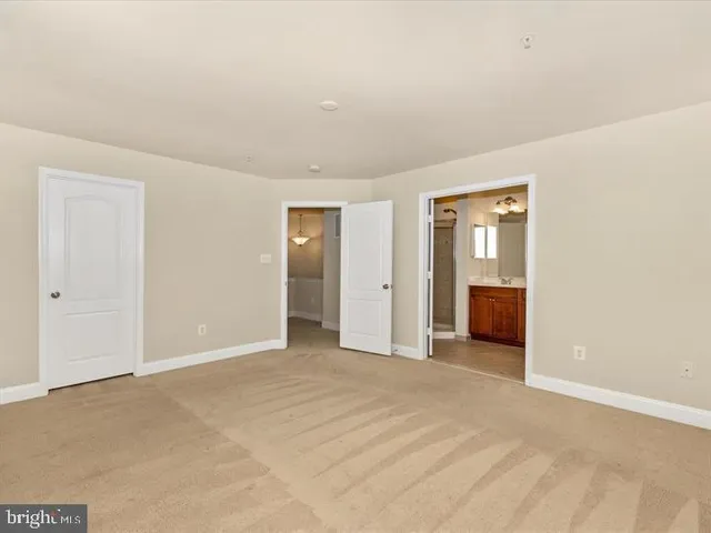 a view of an empty room and fire place