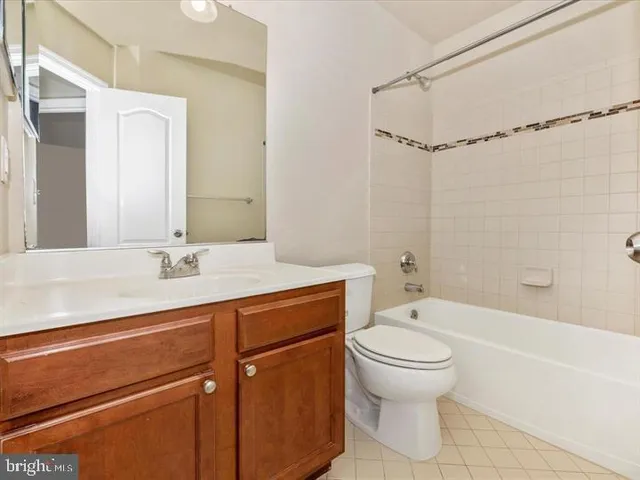 a bathroom with a sink a toilet and a bathtub