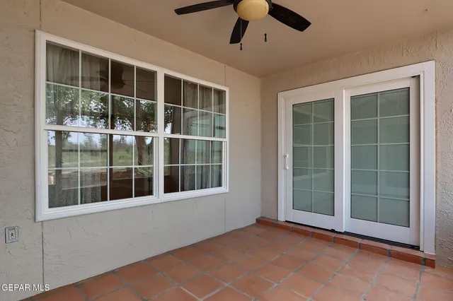 a view of empty room with windows