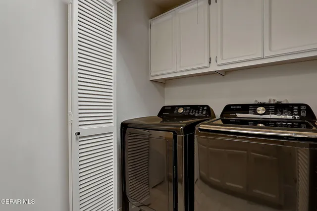 a view of a kitchen with appliances and cabinets