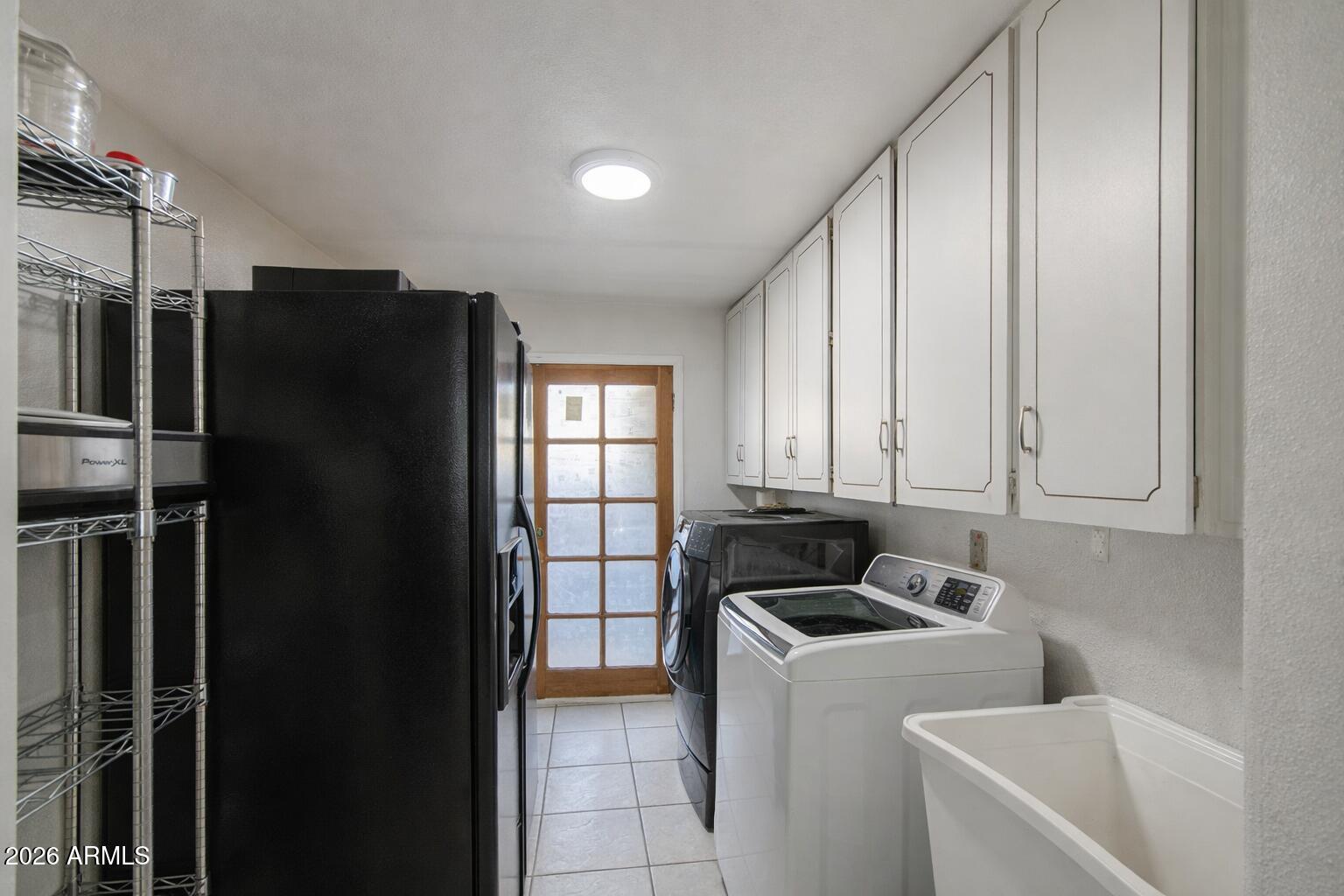 3107 West Montebello Avenue Phoenix, AZ 85017 - Photo 12 of 30 a kitchen with refrigerator and window