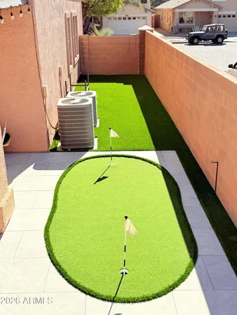 a view of a swimming pool with a chairs