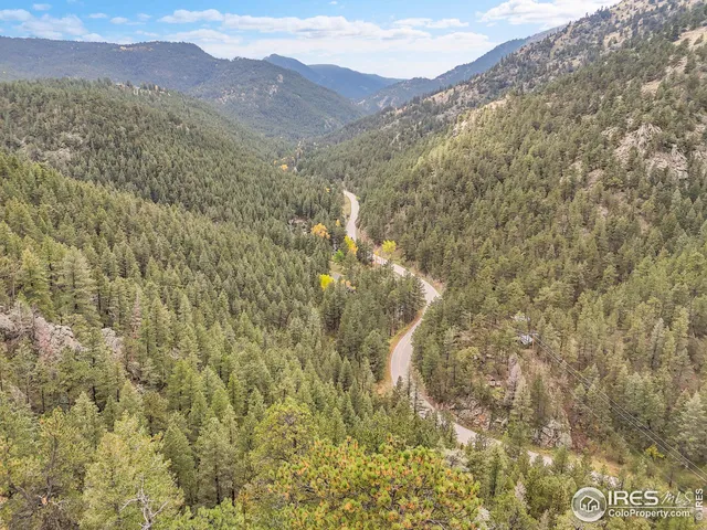 a view of a wooden floor with a mountain in the background