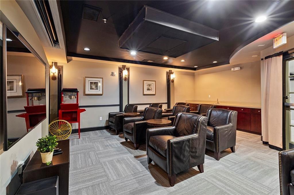 4102 Westchester Ridge Northeast Atlanta, GA 30329 - Photo 28 of 39 a media room with lots of chairs and a projector screen