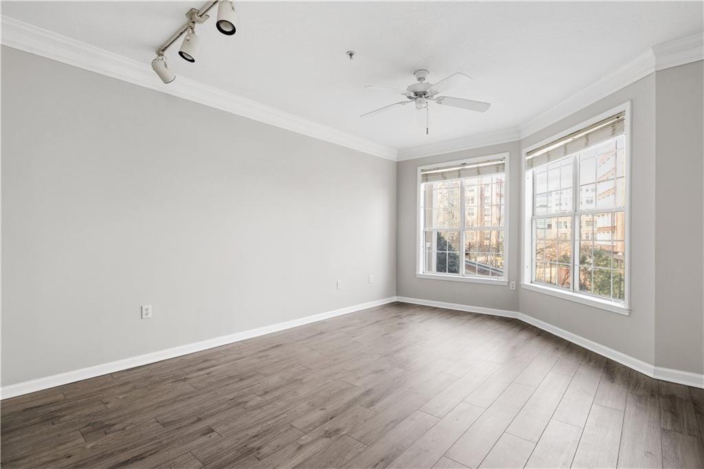 4102 Westchester Ridge Northeast Atlanta, GA 30329 - Photo 9 of 39 a view of an empty room with wooden floor and a window