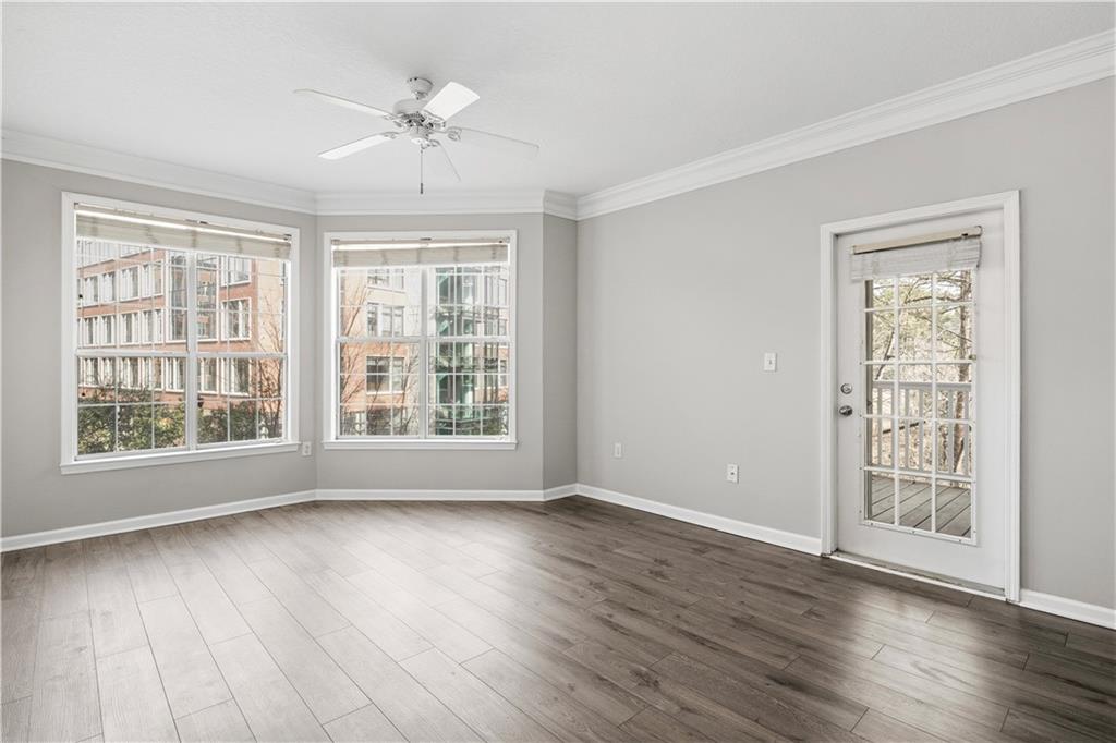 4102 Westchester Ridge Northeast Atlanta, GA 30329 - Photo 10 of 39 a view of an empty room with wooden floor and a window
