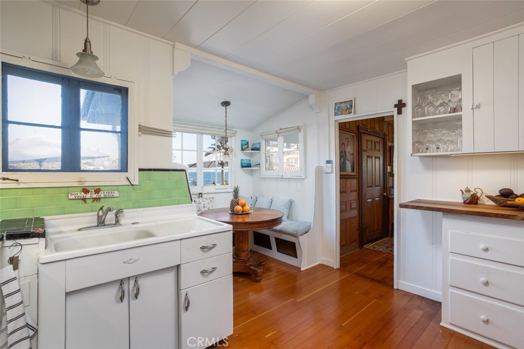 856 Cliff Drive Laguna Beach, CA 92651 - Photo 11 of 28 a kitchen with a sink and cabinets