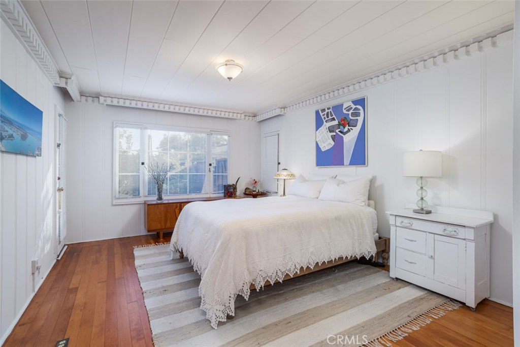 856 Cliff Drive Laguna Beach, CA 92651 - Photo 14 of 28 a bedroom with a large bed and a window