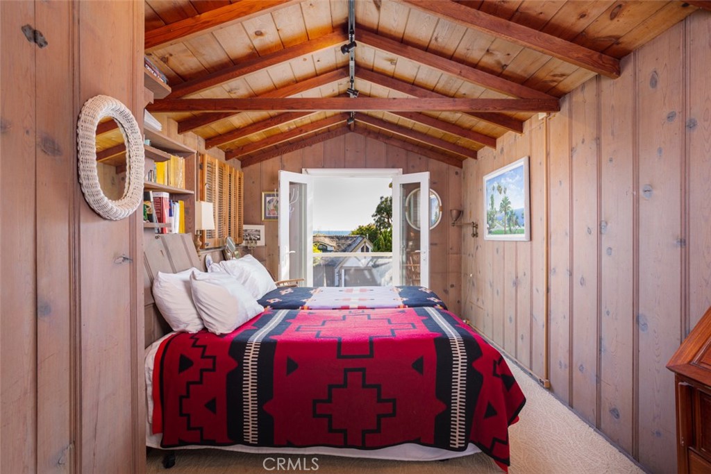 856 Cliff Drive Laguna Beach, CA 92651 - Photo 17 of 28 a bed room with a bed and a window